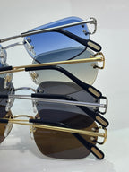 Stacked round-frame sunglasses with metal hinges and tinted lenses in blue and brown