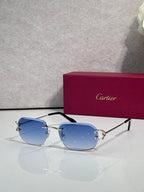 Cartier round-frame sunglasses with blue gradient lenses and silver metal arms