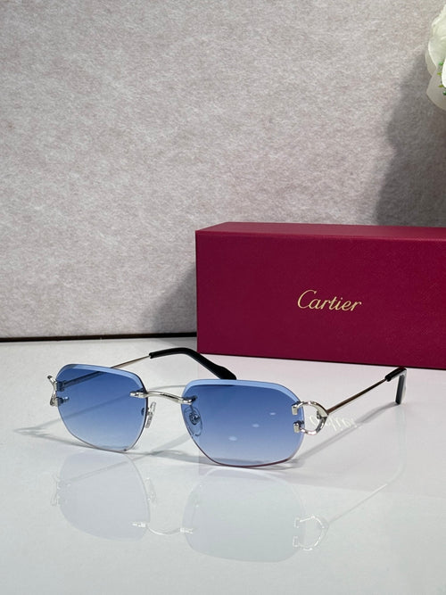 Cartier round-frame sunglasses with blue gradient lenses and silver metal arms