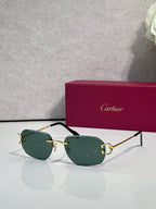 Cartier round-frame sunglasses with green lenses and gold metal accents