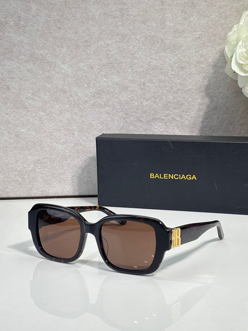 Black square sunglasses with brown-tinted lenses and gold logo temple detail