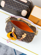 Louis Vuitton monogram canvas crossbody bag with open zipper showing tan interior lining