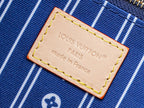 Beige brand label on blue-striped lining reading "Louis Vuitton" and "Made in France"