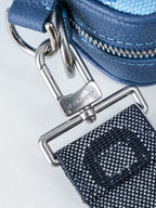 Blue leather bag strap with silver metal clasp and zipper pull