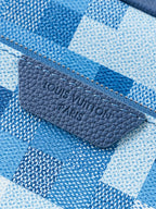 Blue checkered fabric pouch with blue leather logo patch