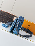 Blue checkered crossbody bag with wide strap and silver D-ring hardware