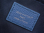 Blue leather interior label reading “Louis Vuitton Paris” with “made in” line