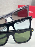 Prada eyeglasses close-up, chrome and black frames with tinted lenses