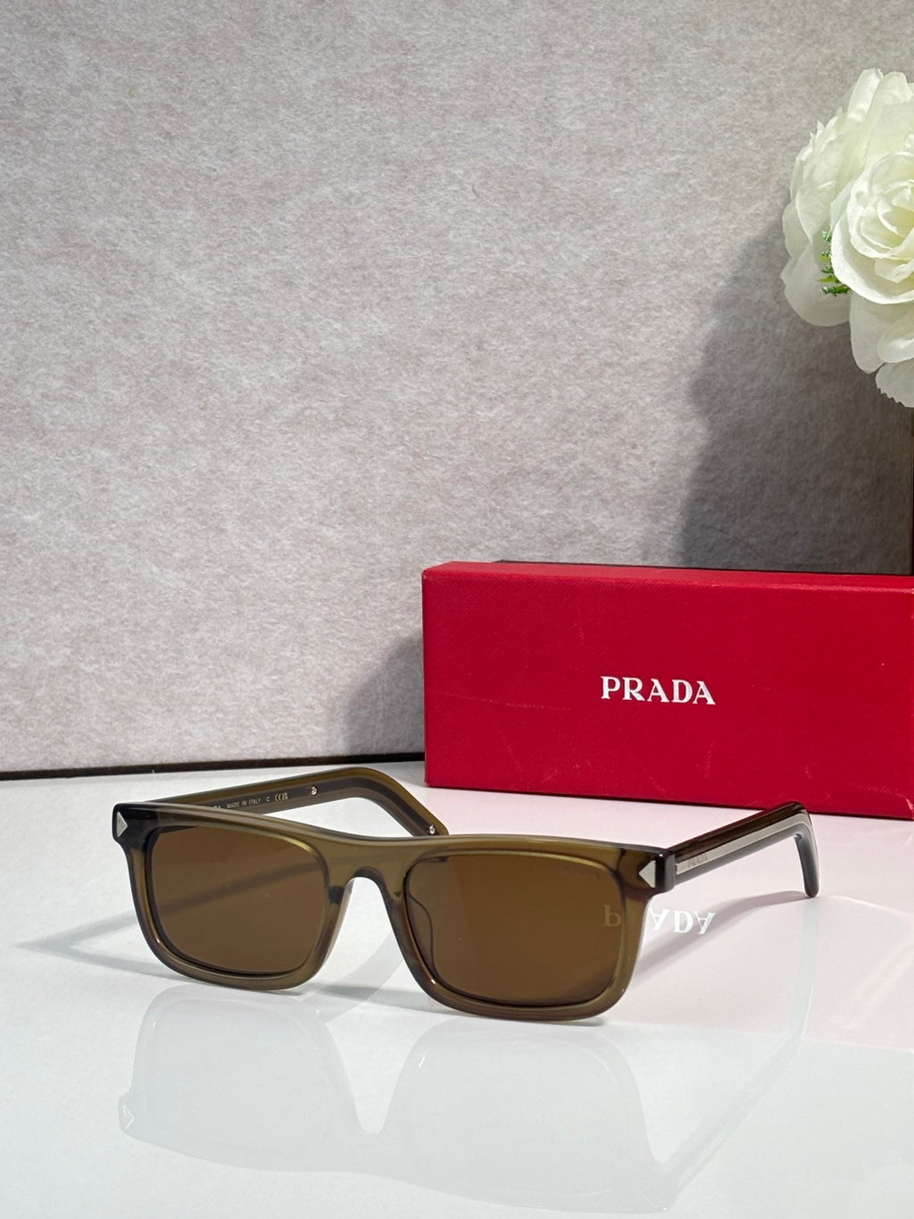Prada rectangular eyeglasses, black frame, brown-tan tinted lenses