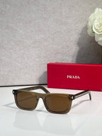 Prada rectangular eyeglasses, black frame, brown-tan tinted lenses
