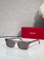 Prada rectangular eyeglasses, clear frame with gray-tinted lenses