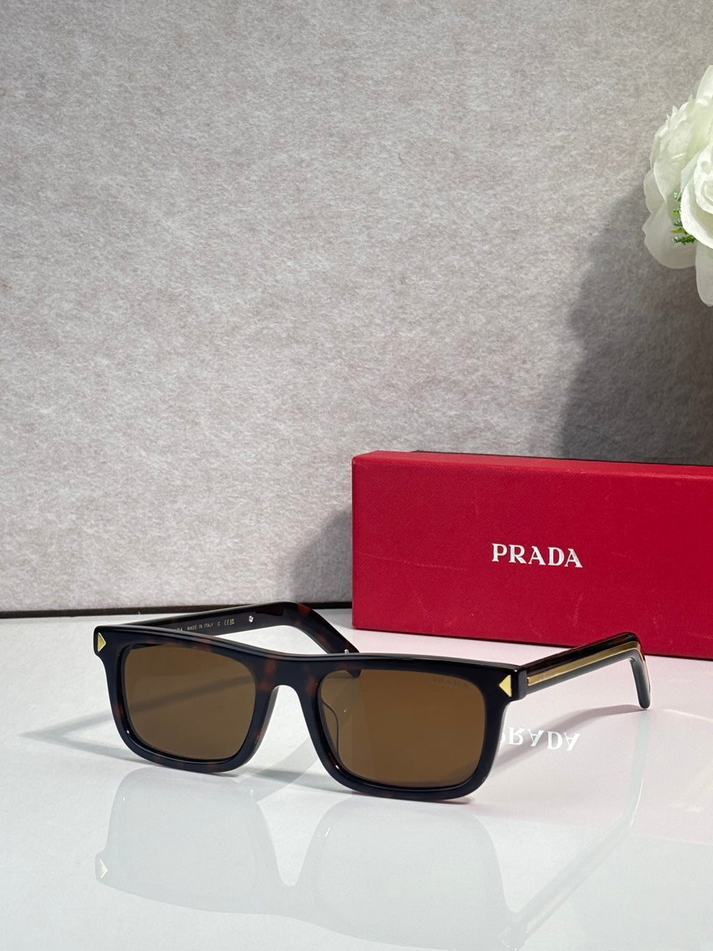 Prada rectangular eyeglasses, black frame, dark brown-tinted lenses