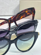 Bvlgari stacked eyeglass frames with tortoise and blue lenses