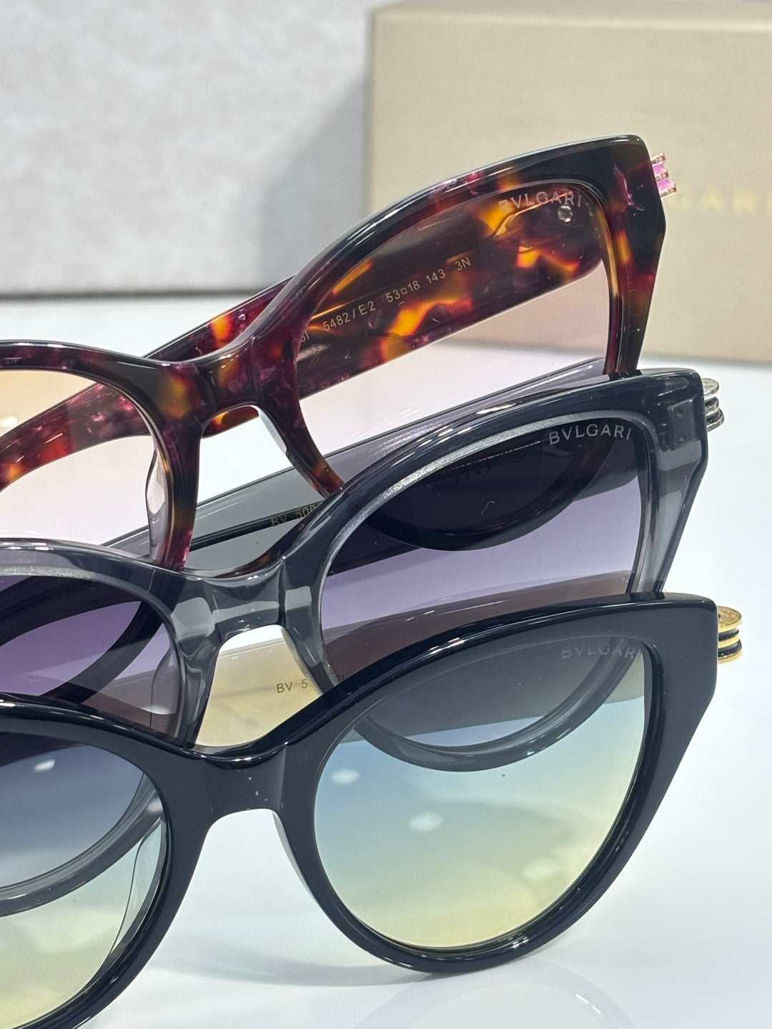 Bvlgari stacked eyeglass frames with tortoise and blue lenses