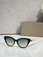 Bvlgari dark blue cat-eye eyeglass frames with gold logo on temples