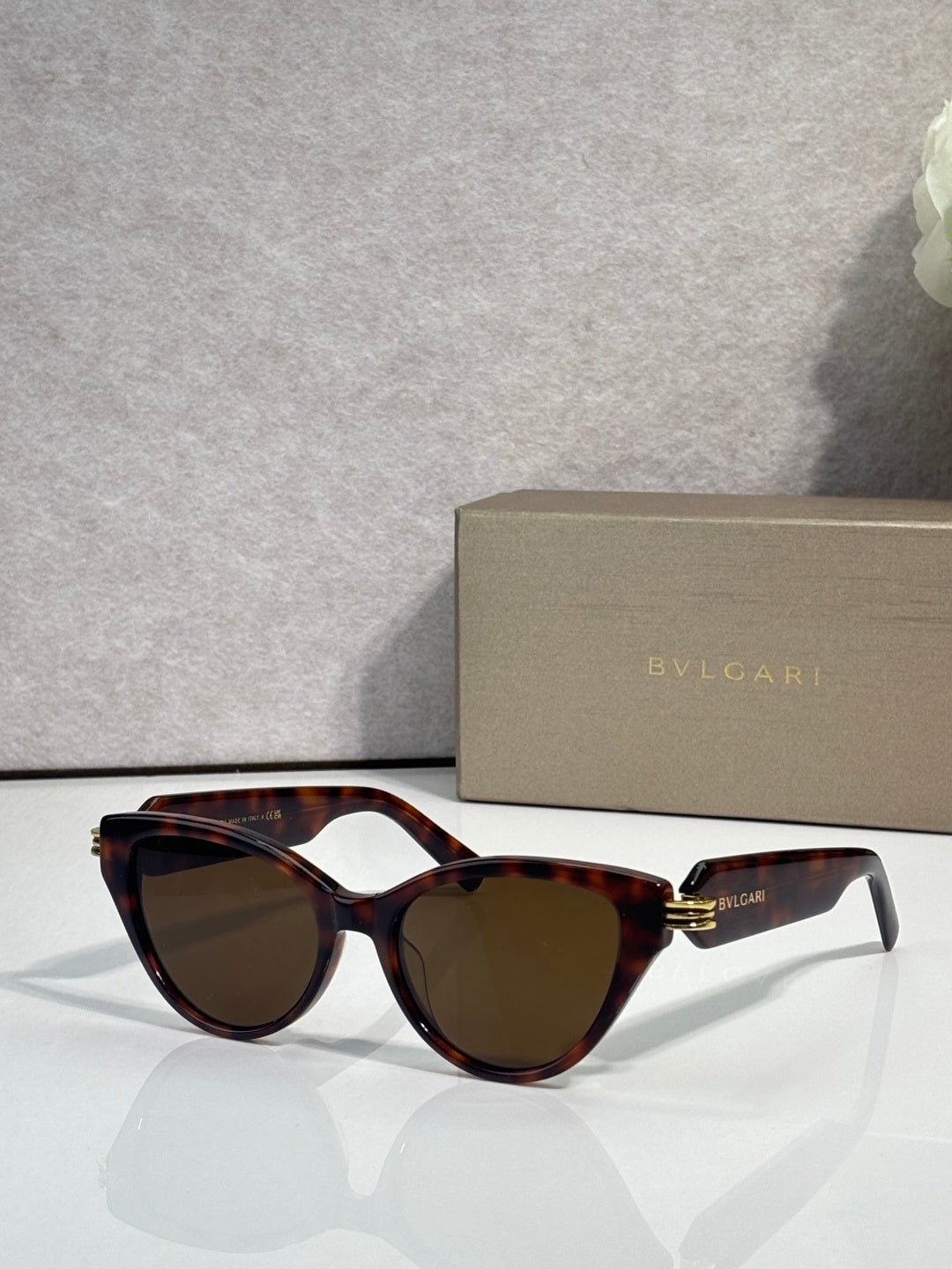 Bvlgari tortoise brown cat-eye sunglasses with gold logo on temples