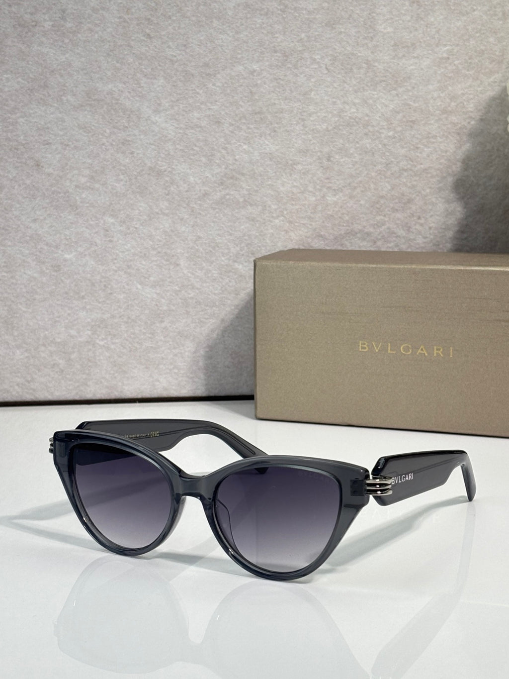 Bvlgari black cat-eye sunglasses with gold logo on temple arms
