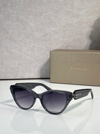 Bvlgari black cat-eye sunglasses with gold logo on temple arms
