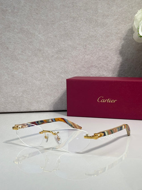 Eyeglass frame with clear lenses, gold-tone metal and patterned multicolor temples
