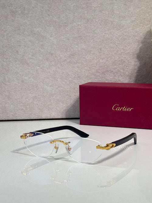 Cartier glasses with clear lenses, gold-tone metal frame, and blue temple accents