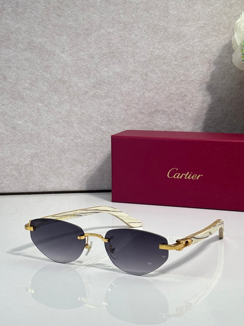 Cartier sunglasses with dark blue lenses and gold-tone frame, light patterned temples