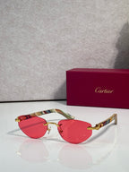 Cartier sunglasses with red tinted lenses and gold-tone frame, multicolor temples