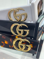 Rectangular sunglasses with gold GG logo on black and white temples