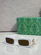 Rectangular white sunglasses with brown lenses and gold GG logo on temples