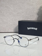 Round eyeglasses with dark blue frame, blue-tinted detail, gold-tone temples