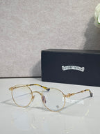 Round eyeglasses with thin gold-tone frame and clear lenses
