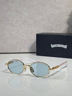Chrome glasses with round light-blue lenses and gold-and-silver frames, clear temples.