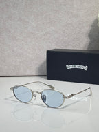 Round clear sunglasses with light blue lenses and silver-toned frame