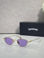 Round gold sunglasses with purple lenses and ornate temple hardware