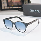 Chanel sunglasses with dark frames and blue tinted lenses, round oversized shape