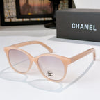 Chanel sunglasses with peach frames and light lenses, round cat-eye style