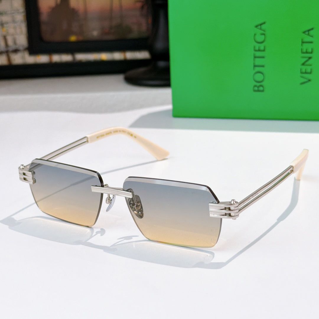 Bottega Veneta glasses with gradient brown lenses, silver frame, light beige temple tips.