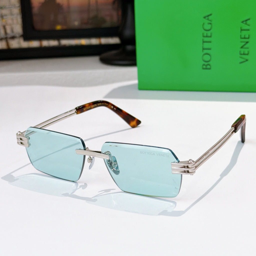 Bottega Veneta glasses with light blue lenses, silver frame, tortoise temple details.