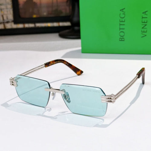 Bottega Veneta glasses with light blue lenses, silver frame, tortoise temple details.