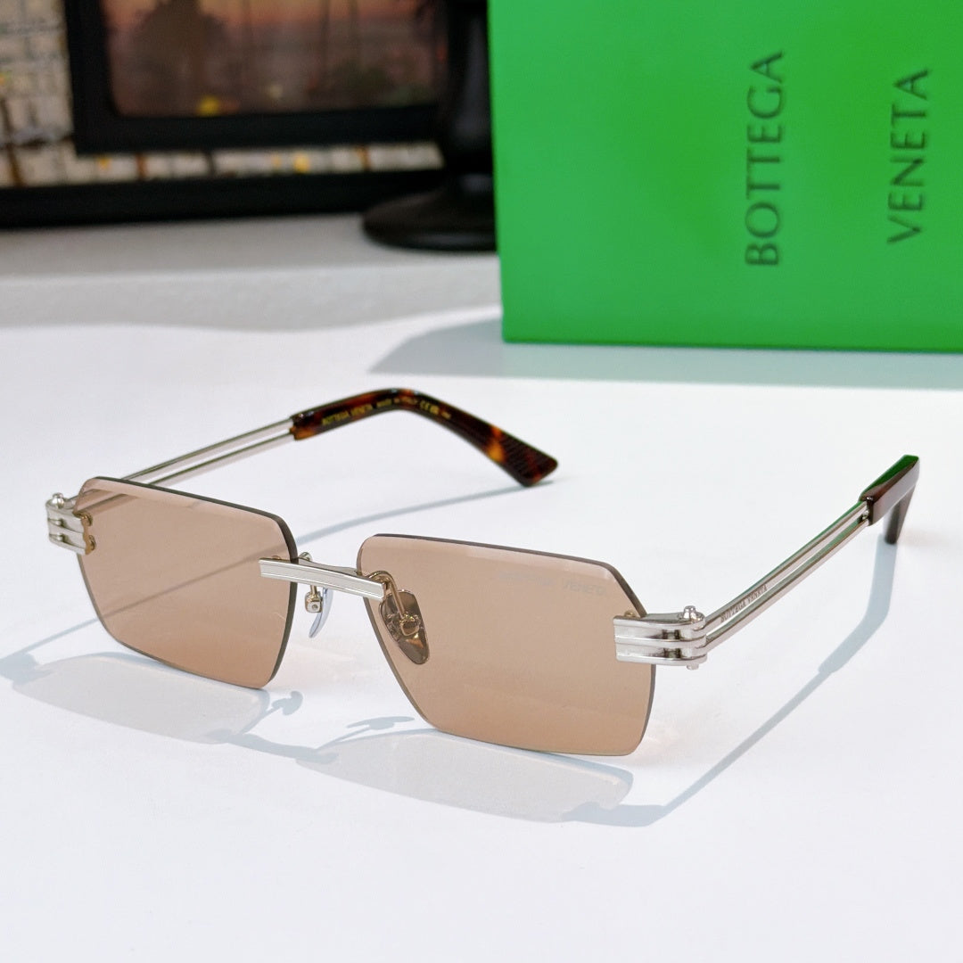 Bottega Veneta glasses with tan lenses, silver frame, tortoise temple section.