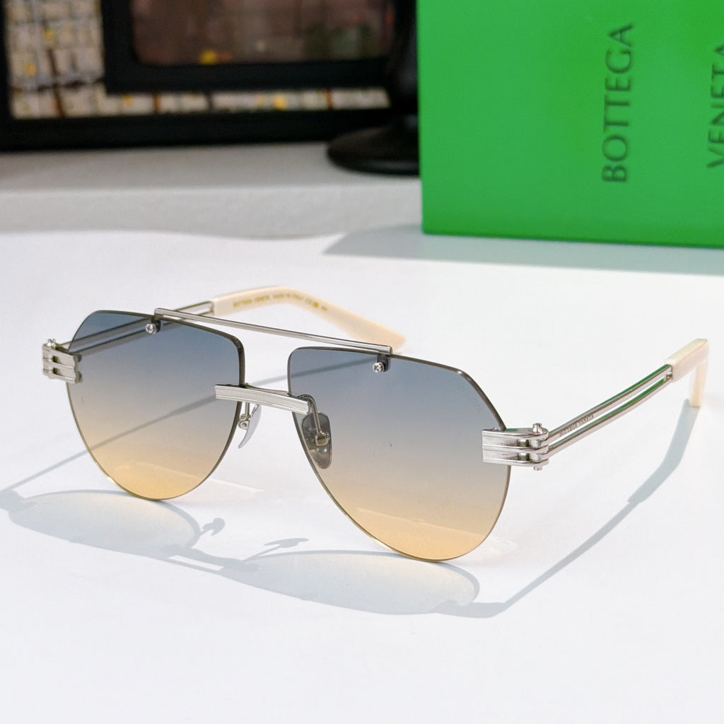 Sunglasses with gray lenses, silver frame, and tortoise-accent temples