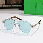 Sunglasses with light blue lenses, silver frame, and tortoise-accent temples