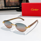 Gold-tone round sunglasses with amber lenses and ornate temple hardware
