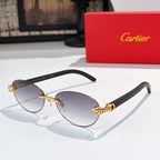 Gold-tone round sunglasses with dark lenses and ornate temple detail