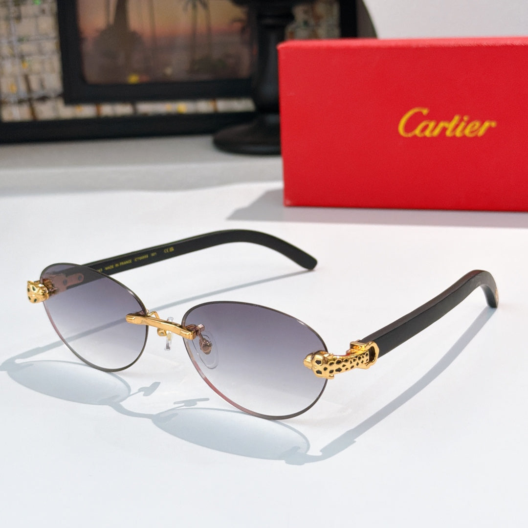 Gold-tone round sunglasses with dark lenses and ornate temple detail