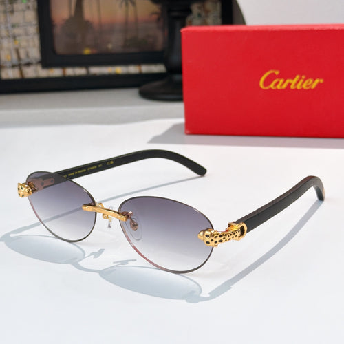 Gold-tone round sunglasses with dark lenses and ornate temple detail