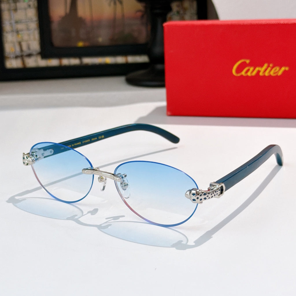 Light blue round sunglasses with gold-tone frames and jeweled temple detail