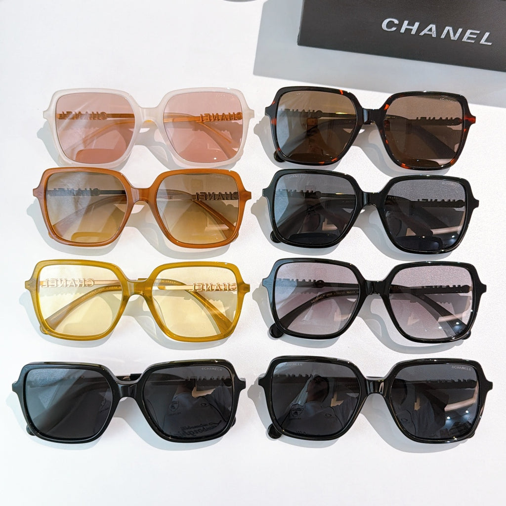 Assorted sunglasses with mixed colored frames and tinted lenses, side by side