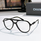 Eyeglasses with black frame and clear lenses with subtle lens tint