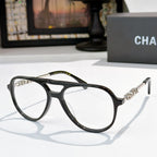 Eyeglasses with black frame, clear lenses, and silver-tone temple details