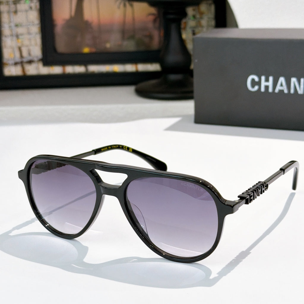 Sunglasses with black frame, purple tinted lenses, and silver-tone temple details